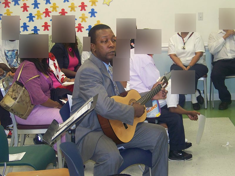 Performing the guitar with my students.